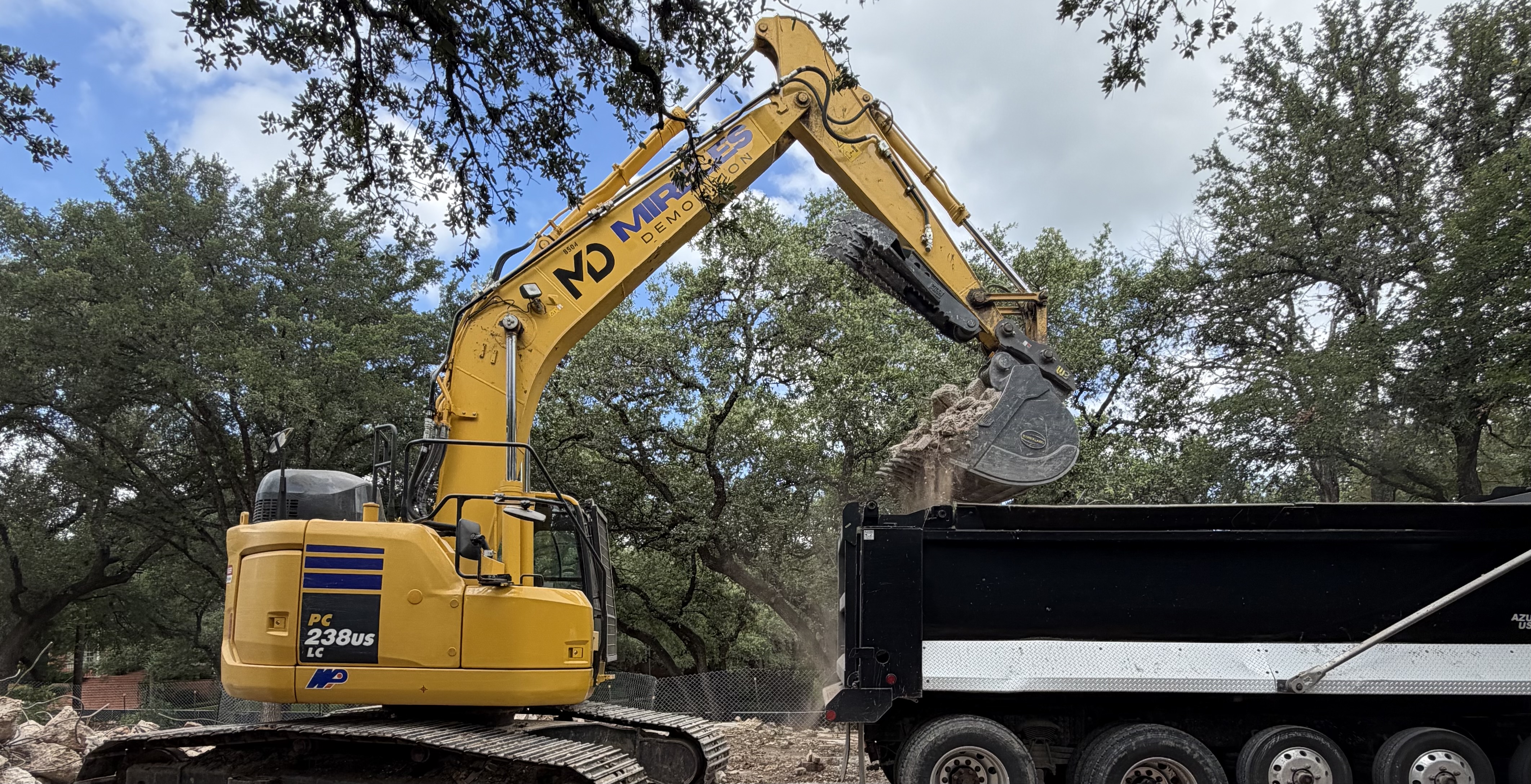 Mireles Demolition excavator loading material
